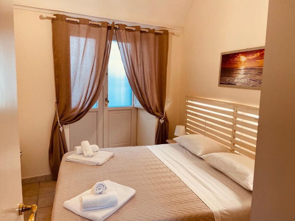 Postel nebo postele na pokoji v ubytování Dimore di Lecce - Il Vico