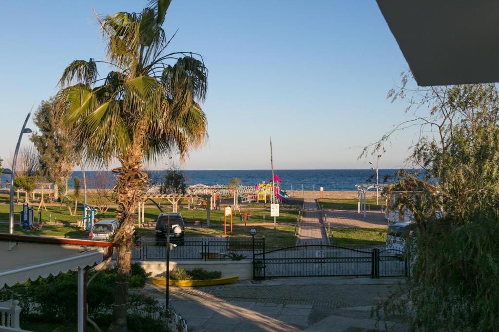 a park with a playground and the ocean in the background at Magic Garden Apart in Kemer