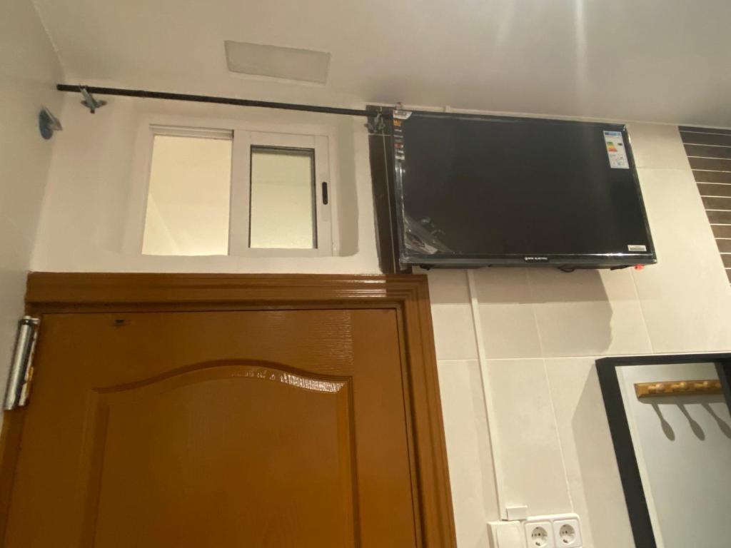 TV a/nebo společenská místnost v ubytování Hostal Granvia 628