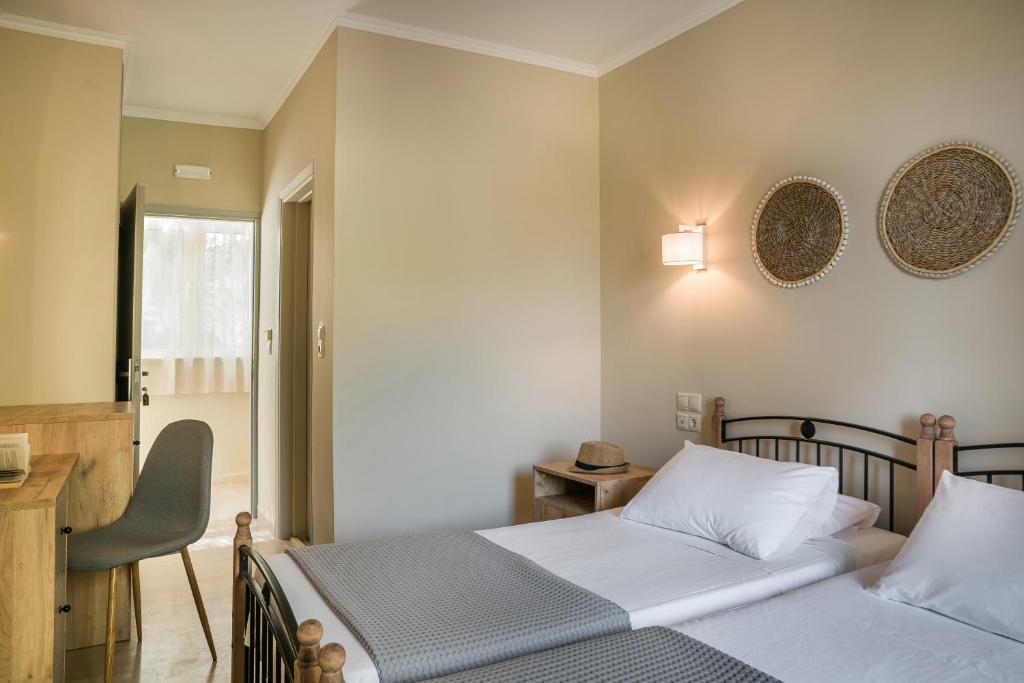 Postel nebo postele na pokoji v ubytování Irilena Hotel