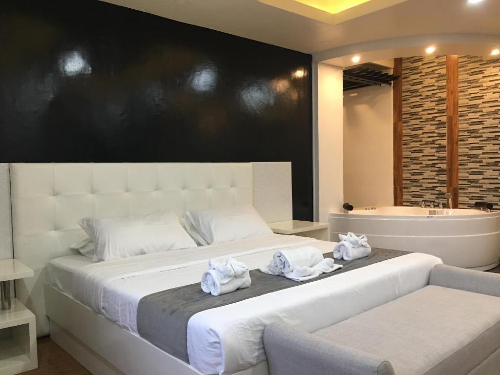 Postel nebo postele na pokoji v ubytování Rangya Hotel
