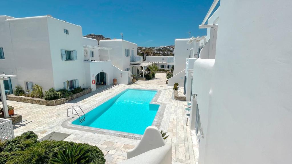 an image of a villa with a swimming pool at BLUE DAISY House, Ornos, by MyconBay Mykonos in Ornos