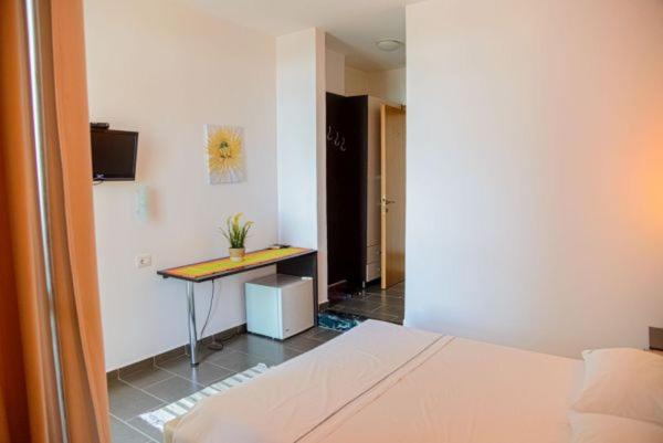 Postel nebo postele na pokoji v ubytování Hotel Aurora