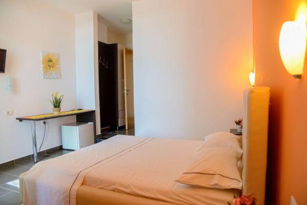Postel nebo postele na pokoji v ubytování Hotel Aurora