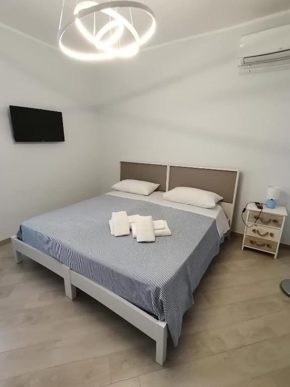 Postel nebo postele na pokoji v ubytování Tamarix