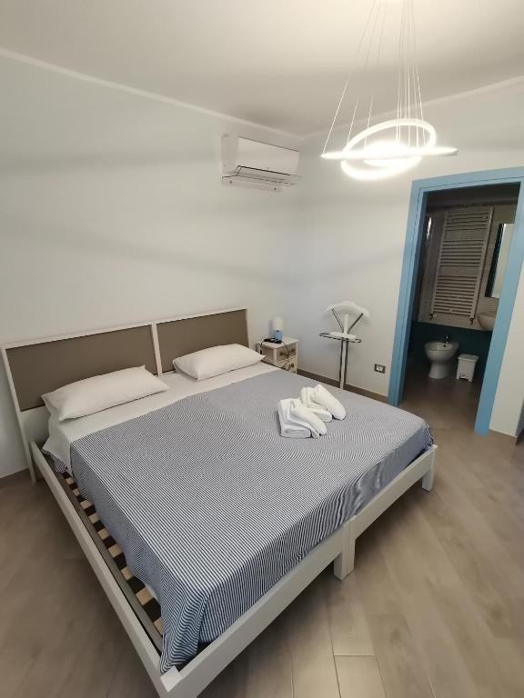Postel nebo postele na pokoji v ubytování Tamarix