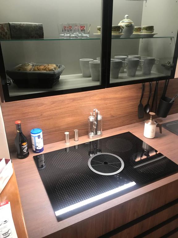 A kitchen or kitchenette at Il Borghetto di San Giuseppe EtnaRooms&Apartments