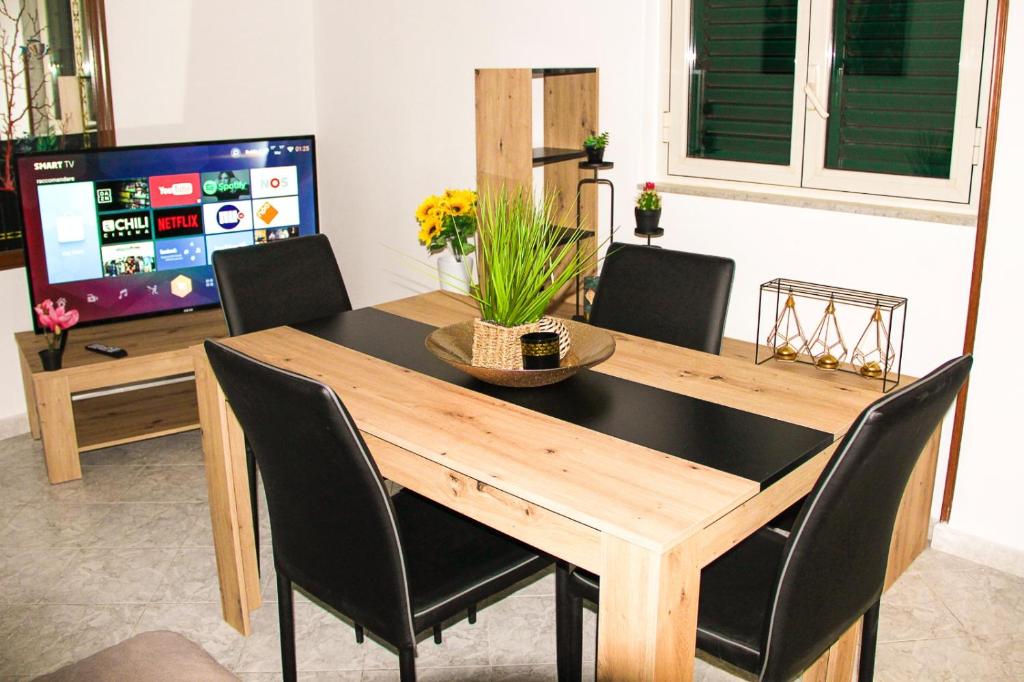 A television and/or entertainment centre at Gabry central apartment Palermo
