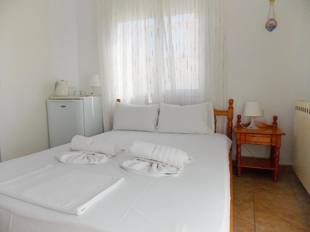 Postel nebo postele na pokoji v ubytování Hotel Sgouridis