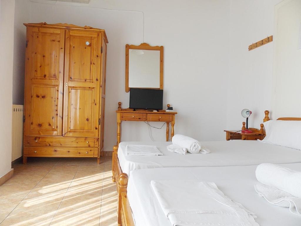 Postel nebo postele na pokoji v ubytování Hotel Sgouridis