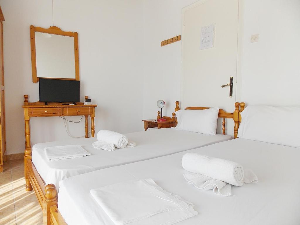 Postel nebo postele na pokoji v ubytování Hotel Sgouridis