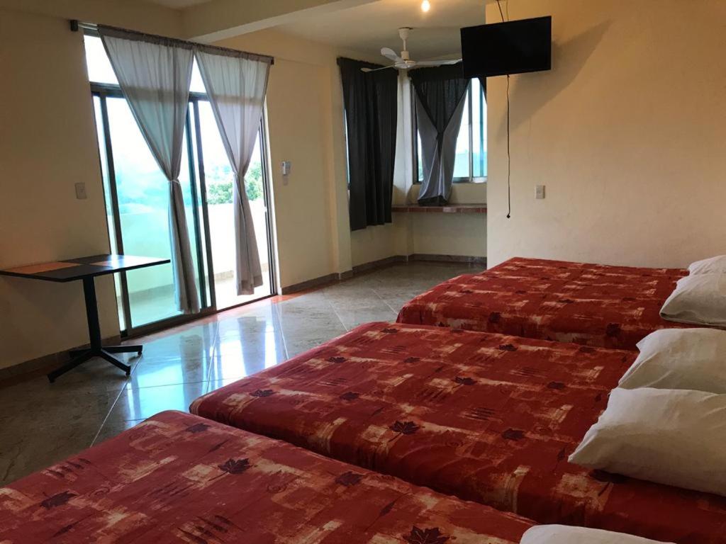 Postel nebo postele na pokoji v ubytování Hotel Sociedad y Maristas