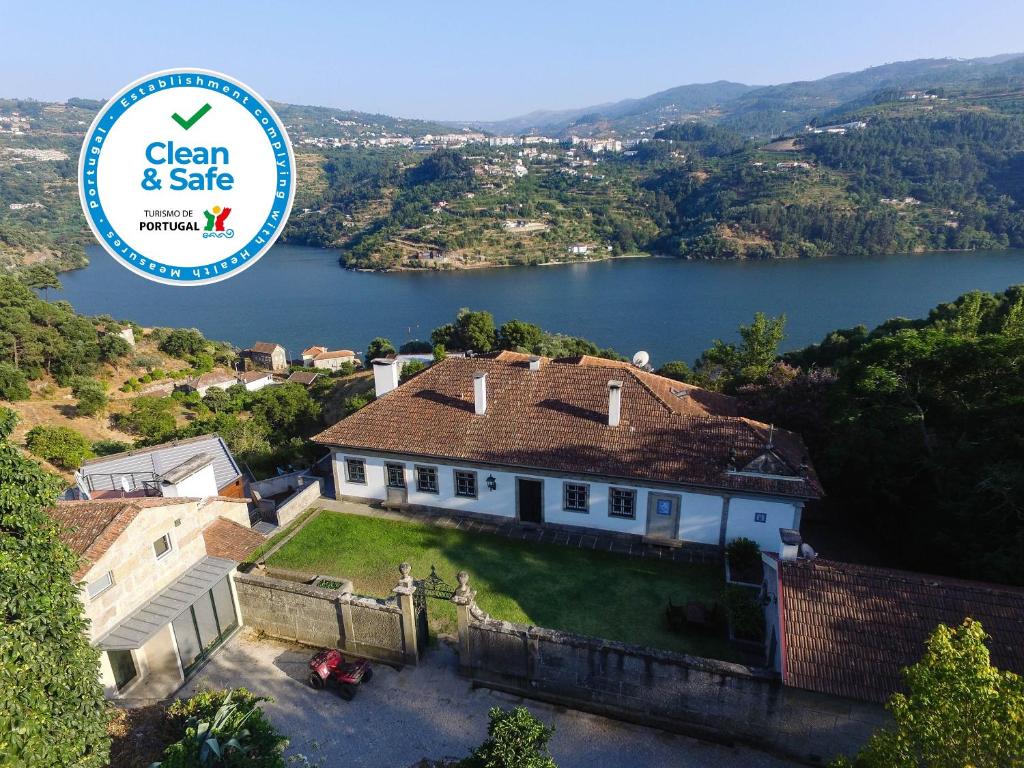 an image of a house with a view of a lake at Quinta Das Quintas & Spa in Baião