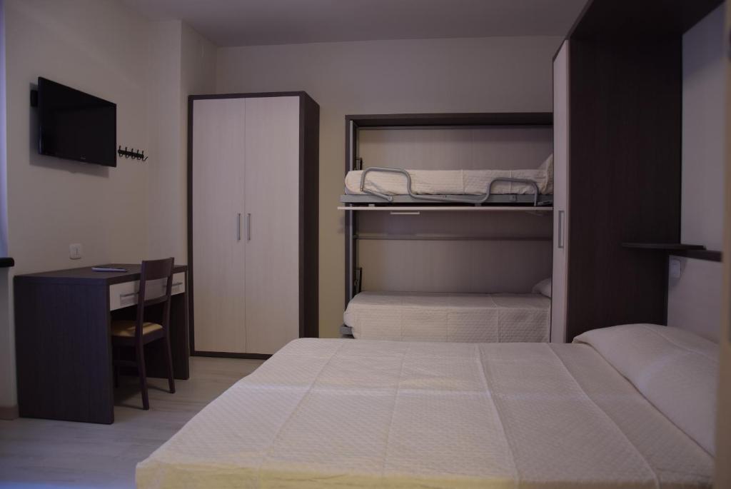 Letto o letti in una camera di B&B L'Acero