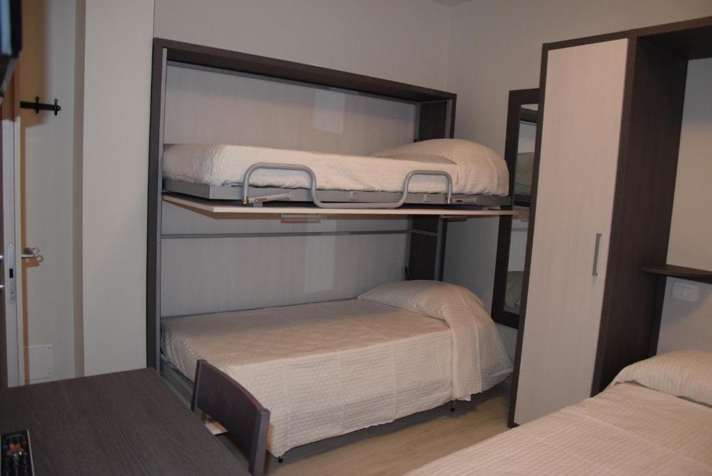 Letto o letti in una camera di B&B L'Acero