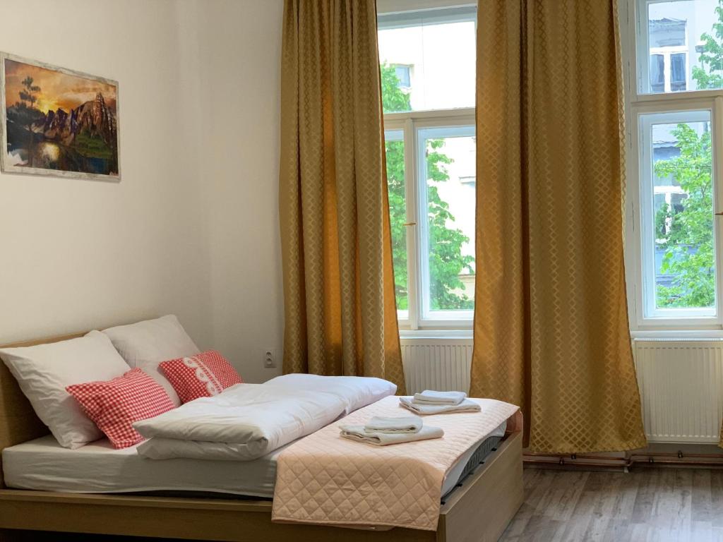 Łóżko lub łóżka w pokoju w obiekcie KK Apartments