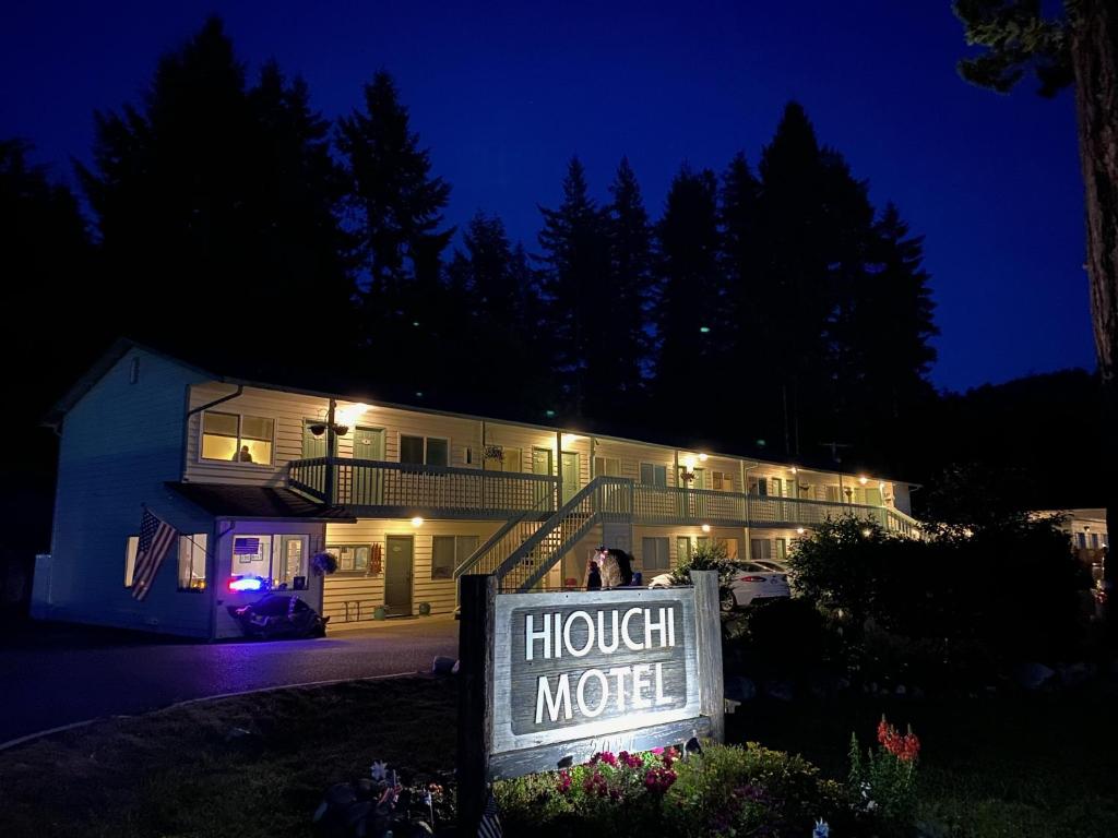 a building with a sign in front of it at night at Hiouchi Motel in Crescent City