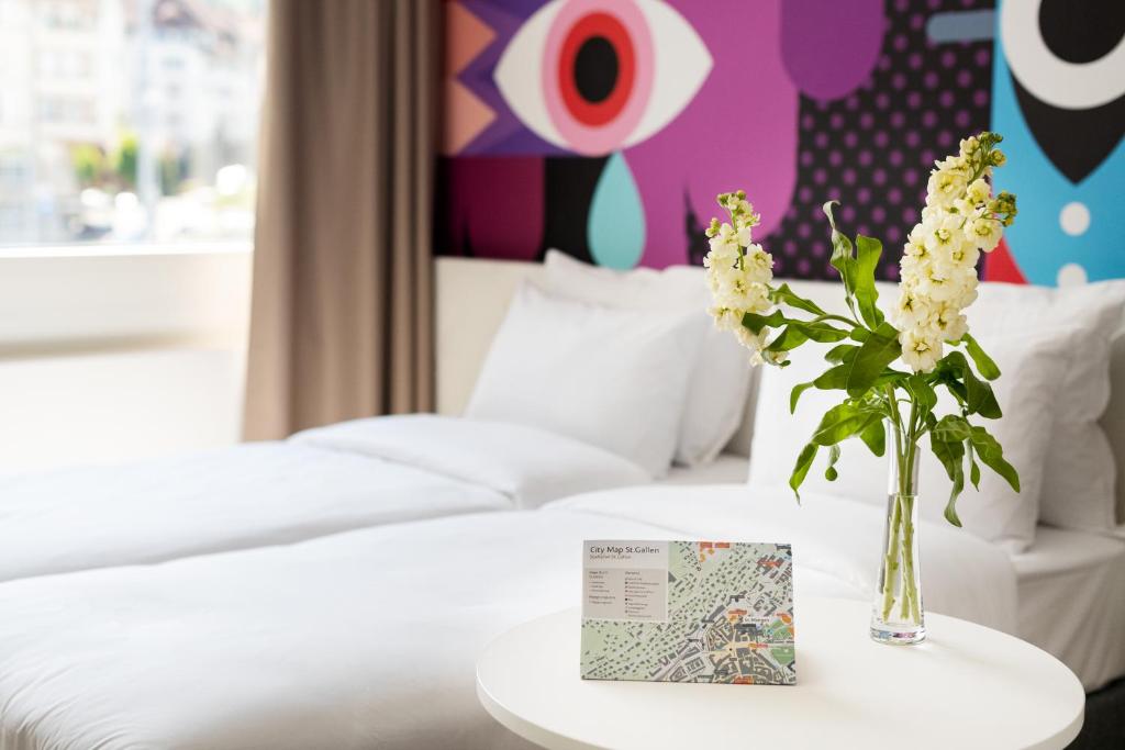 Postel nebo postele na pokoji v ubytování B&B HOTEL St Gallen