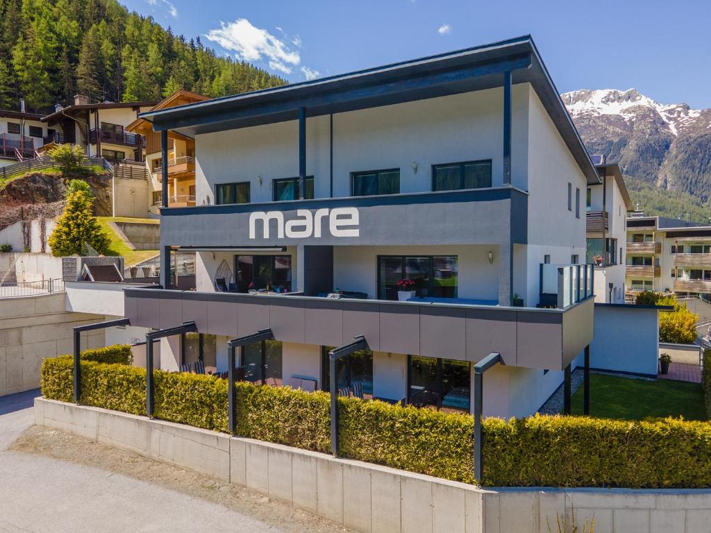 a large white building with the msg sign on it at Apart Mare in Sölden
