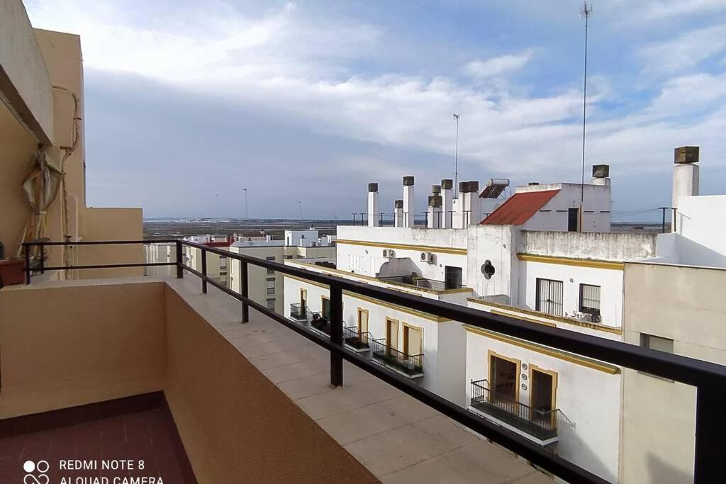 a balcony with a view of a building at Atico con terraza en San Fernando (Cádiz) in San Fernando