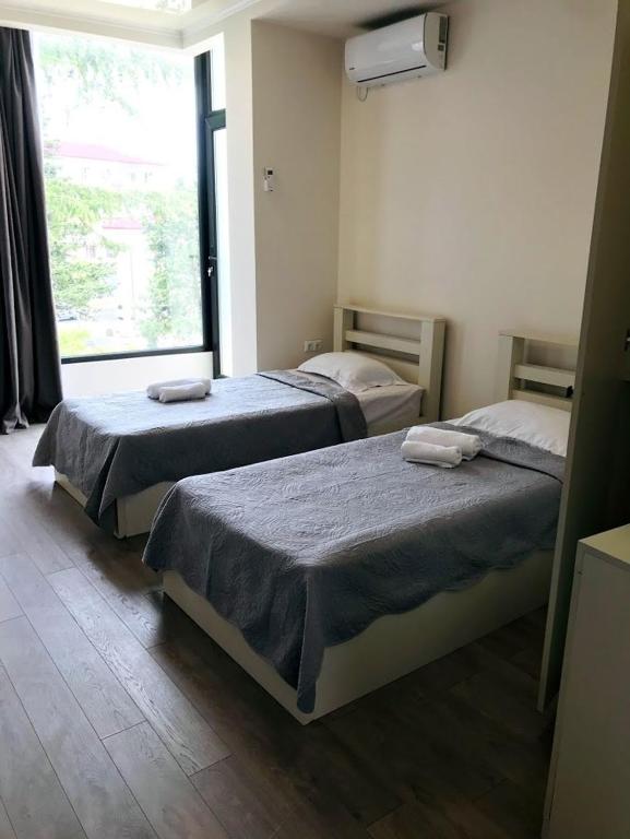 Postel nebo postele na pokoji v ubytování Gurya