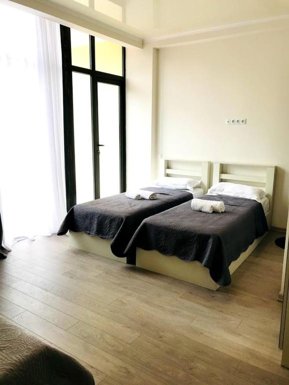 Postel nebo postele na pokoji v ubytování Gurya