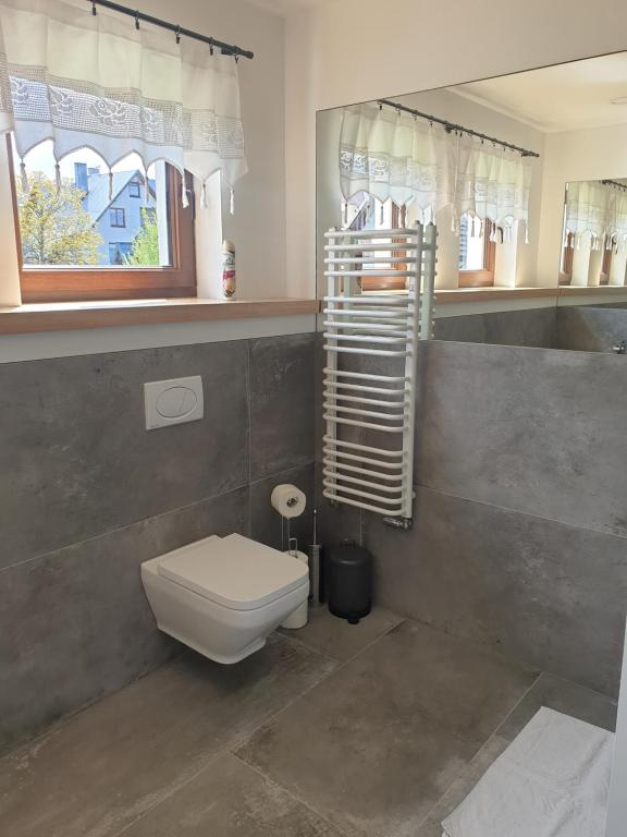 Koupelna v ubytování Apartamenty na Rycerskiej