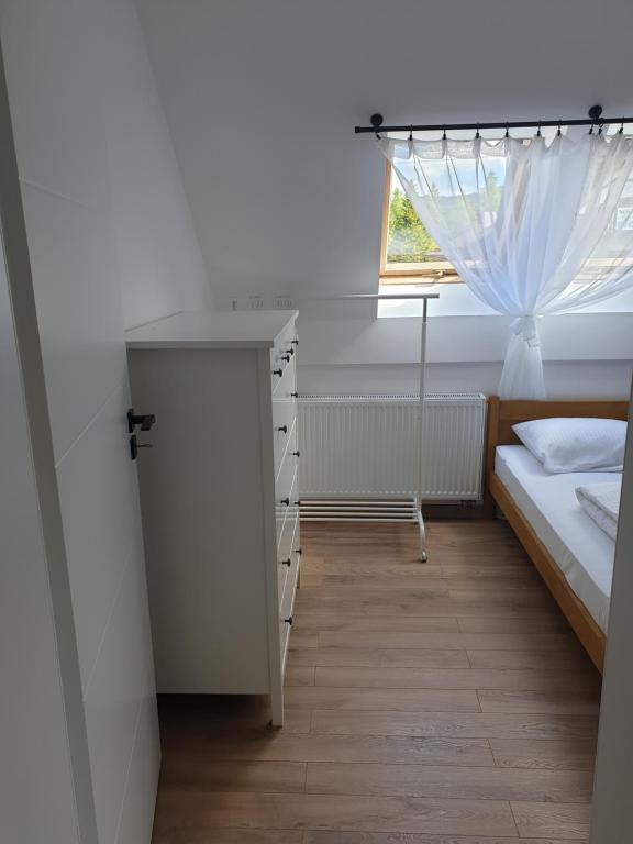 Postel nebo postele na pokoji v ubytování Apartamenty na Rycerskiej