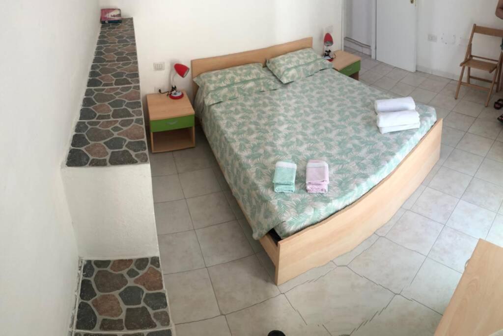 Postel nebo postele na pokoji v ubytování Buggerru la bomboniera