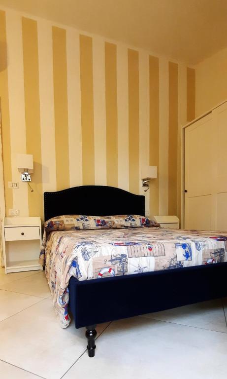 Łóżko lub łóżka w pokoju w obiekcie Smeralda Wave - Sea View Apartment