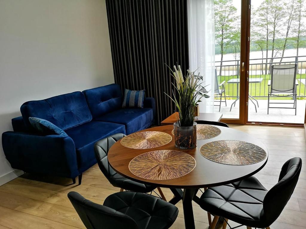 Posedenie v ubytovaní APARTAMENTY SKORUPKI-Mazury Mikołajki