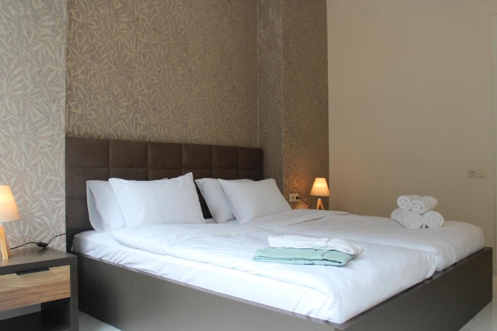 Postel nebo postele na pokoji v ubytování Horizons Hotel Rooms