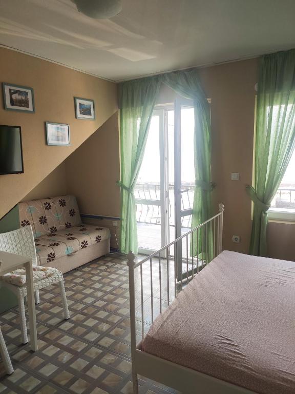 Postel nebo postele na pokoji v ubytování Studio Apartments Krasici