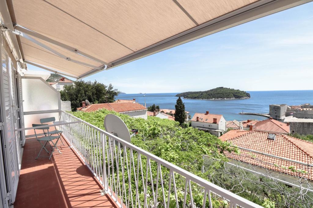 a balcony with a view of the ocean at Apartment Rose 2 in Dubrovnik