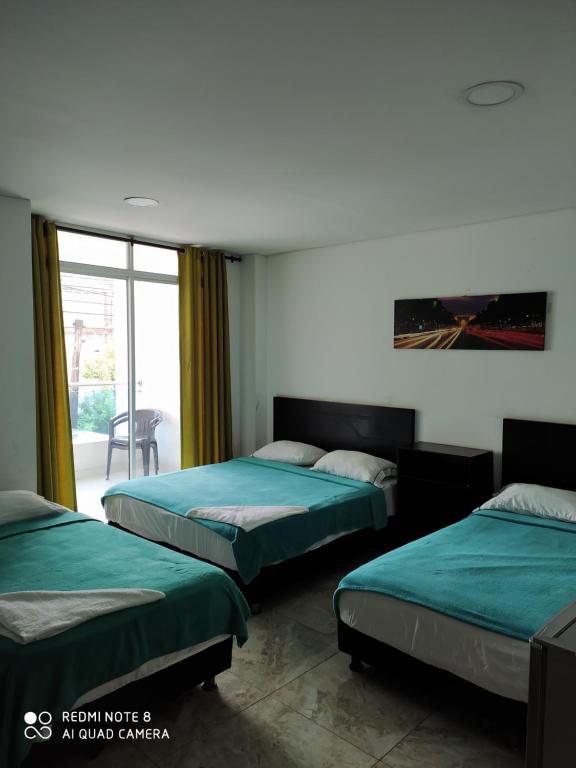 Katil atau katil-katil dalam bilik di Hotel La Mar Cartagena