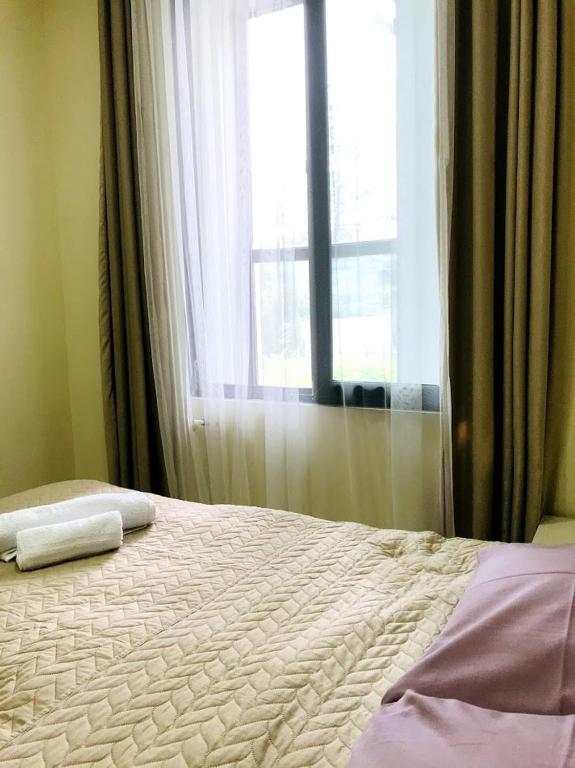 Postel nebo postele na pokoji v ubytování Gurya