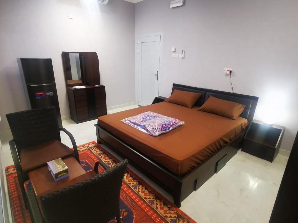 Postel nebo postele na pokoji v ubytování Al Hamra Guest House