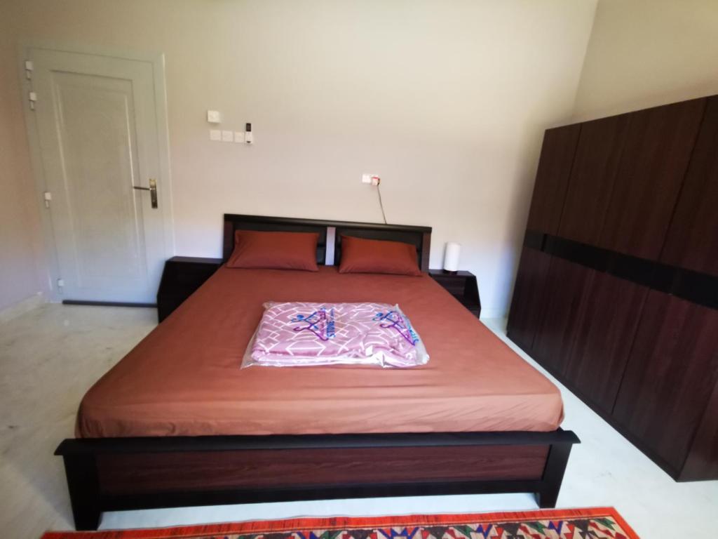 Postel nebo postele na pokoji v ubytování Al Hamra Guest House