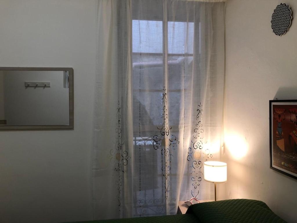 Posteľ alebo postele v izbe v ubytovaní Casa di fronte la Cattedrale
