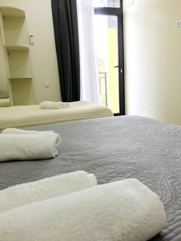Postel nebo postele na pokoji v ubytování Gurya