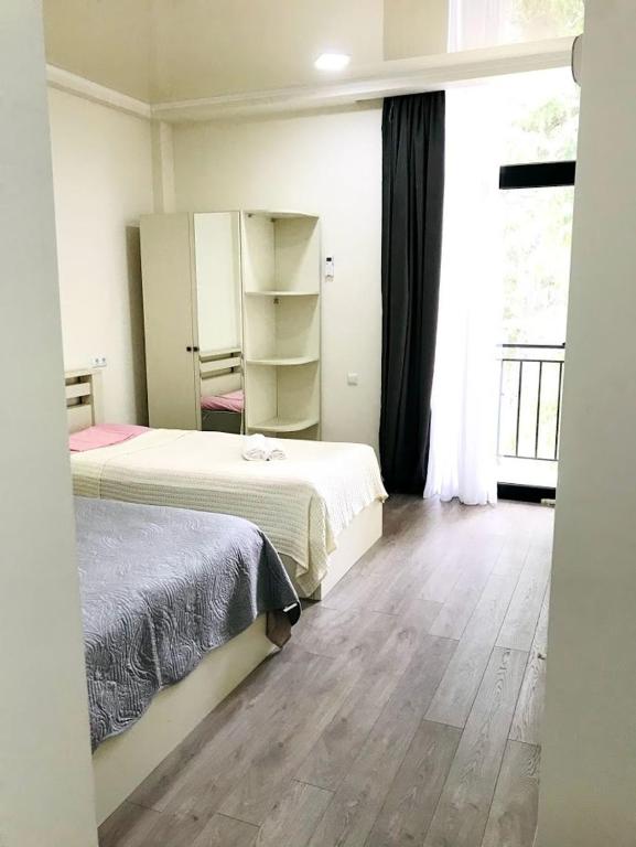Postel nebo postele na pokoji v ubytování Gurya