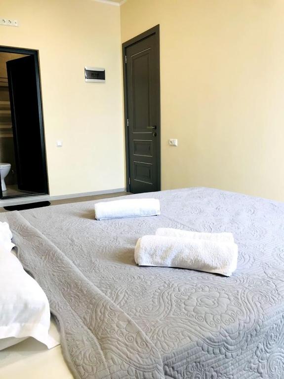 Postel nebo postele na pokoji v ubytování Gurya