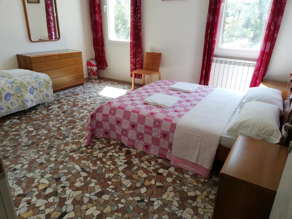 Postel nebo postele na pokoji v ubytování Venice View Guesthouse
