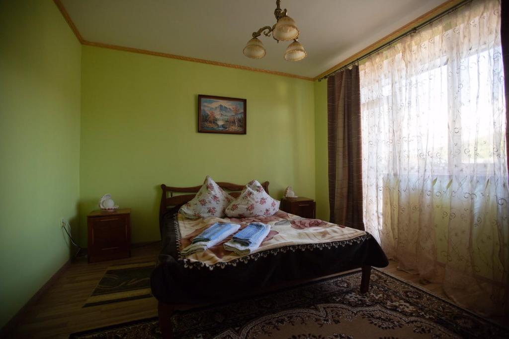 Postel nebo postele na pokoji v ubytování Guest House in Drachino