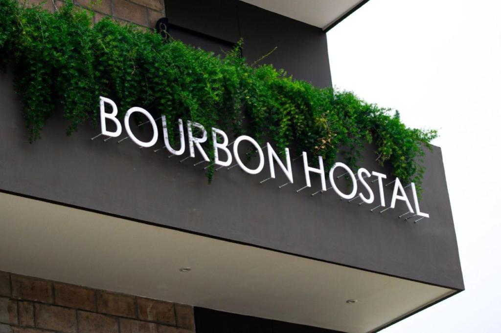 a sign for a bon accord hospital on the side of a building at BOURBON HOSTAL in Juayúa
