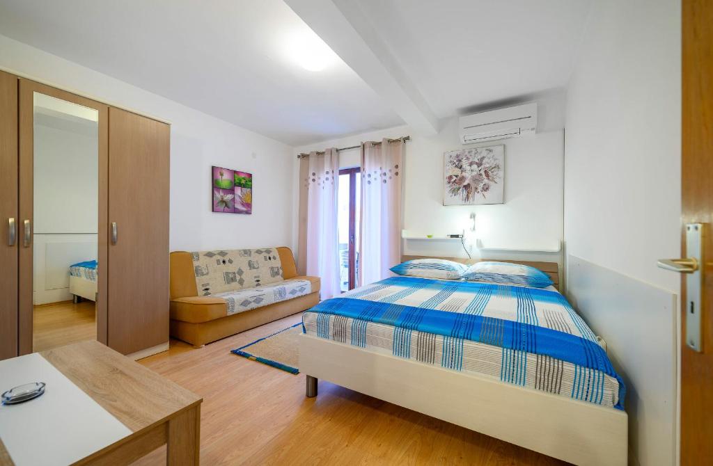 Posteľ alebo postele v izbe v ubytovaní Stela Apartments