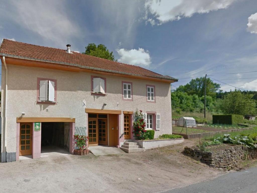 a large house with a driveway in front of it at Gîte Taintrux, 4 pièces, 5 personnes - FR-1-589-261 in Taintrux