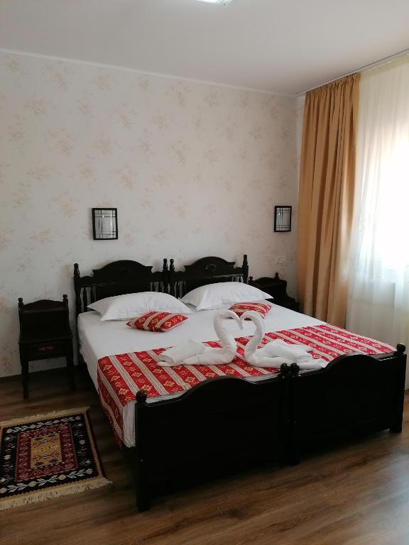 Postel nebo postele na pokoji v ubytování Hanul Hora Romaneasca