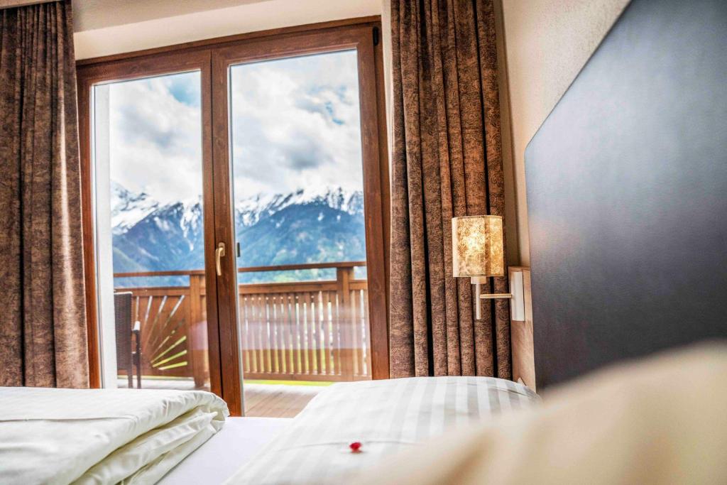 Postel nebo postele na pokoji v ubytování Hotel Montana
