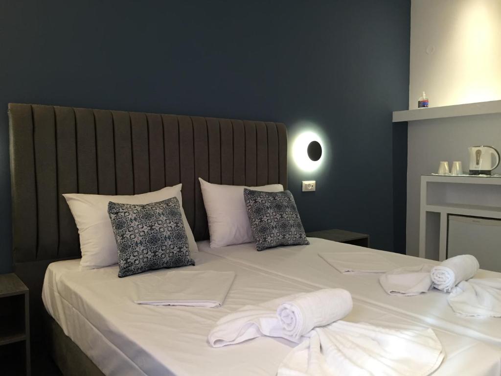 Ліжко або ліжка в номері City Pearl Hotel
